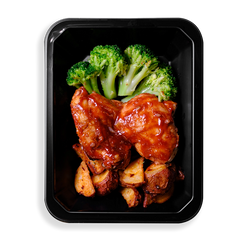 Filling this black prepared meal container are broccoli, chicken and red potatoes.  There are two large pieces of BBQ chicken and four very green piece of broccoli. The sauce on the chicken is rich and the flavor does not look to be lacking.