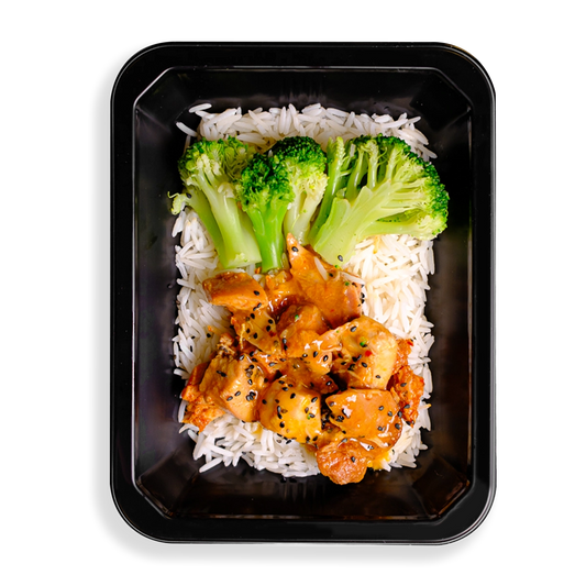 this looks like the best chinese food i have ever seen, what makes it different is that it looks so clean and healthy. broccoli stalks and orange colored chicken sit on top of a bed of white rice filling up this black togo container.  everything looks clean and seasoned well making it a perfect health prepared meal for people wanting both flavor and healthy eating.