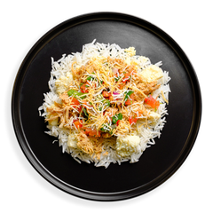 Overhead view of a nutrient-packed breakfast plate showcasing a bed of steamed white rice layered with shredded chicken, golden scrambled egg chunks, and fresh pico de gallo. Topped with a fine dusting of cheddar and pepper jack cheese, this wholesome health food meal blends creamy, savory, and tangy flavors in every bite.