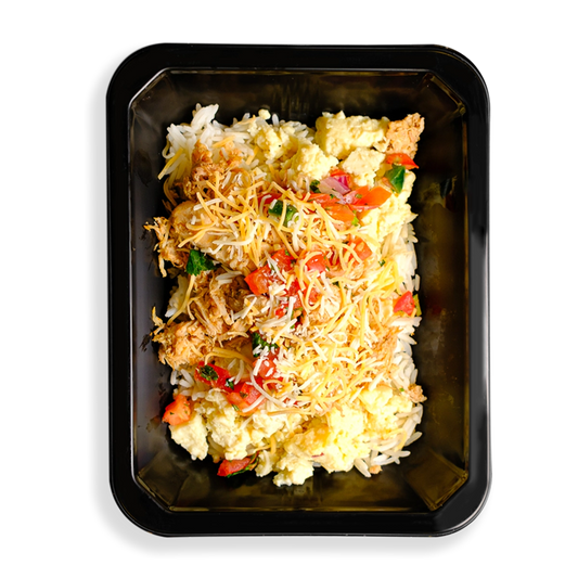 A hearty breakfast scramble with white rice, fluffy scrambled eggs, shredded chicken thighs, topped with vibrant pico de gallo and melted cheddar jack cheese, all packed in a black to-go container.  This food looks like the perfect meal to start the day with and appears to be made for those who want to eat good but not spare flavor in their life.