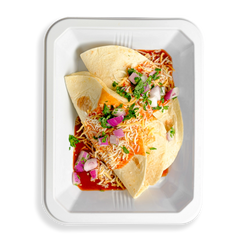 A nutritious and flavorful to-go meal featuring shredded chicken thighs wrapped in toasted flour tortillas, topped with black beans, cilantro, and onions. Set over a savory enchilada sauce and finished with a blend of Cheddar and Jack cheese, this protein-packed, balanced meal is perfect for those seeking a healthy, prepared option on the go.  The red onion on top of the cheese looks very tasty and the tortillas looks cooked to perfection.