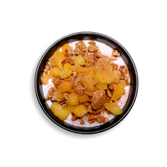 A top-down view of a healthy prepared meal in a black bowl featuring creamy cinnamon-agave Greek yogurt layered with golden diced peaches. Crunchy granola clusters and chopped pecans are generously sprinkled on top, creating a vibrant and textured breakfast or snack. This health food dish highlights a balance of protein, fiber, and natural sweetness, perfect for clean eating and healthy meal prep.