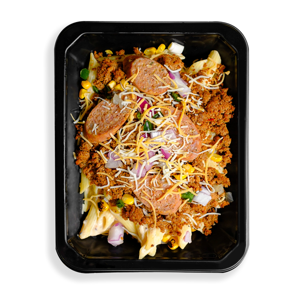 this is a container filled with tons of flavors, textures and colors.  I see sausage atop ground meat as well as pasta and some mixed veggies.  Shredded yellow and white cheese sits on top of all this food.  This food is filling a togo container and looks like a perfect meal for someone on the go while trying to watch what they eat.